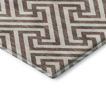 Close-up of Dalyn Luxury Indoor/Outdoor The Reserve TR5 Coffee Washable Area Rug with a beige and coffee geometric pattern.