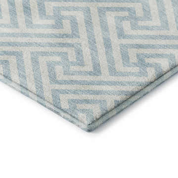 Close-up of the Dalyn Luxury The Reserve TR5 Sky Washable Area Rug, featuring a geometric pattern in sky blue and white.
