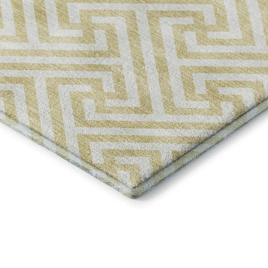 Close up of the Dalyn Luxury The Reserve TR5 Wheat Washable Area Rug, showing geometric pattern and chestnut & peach colors.
