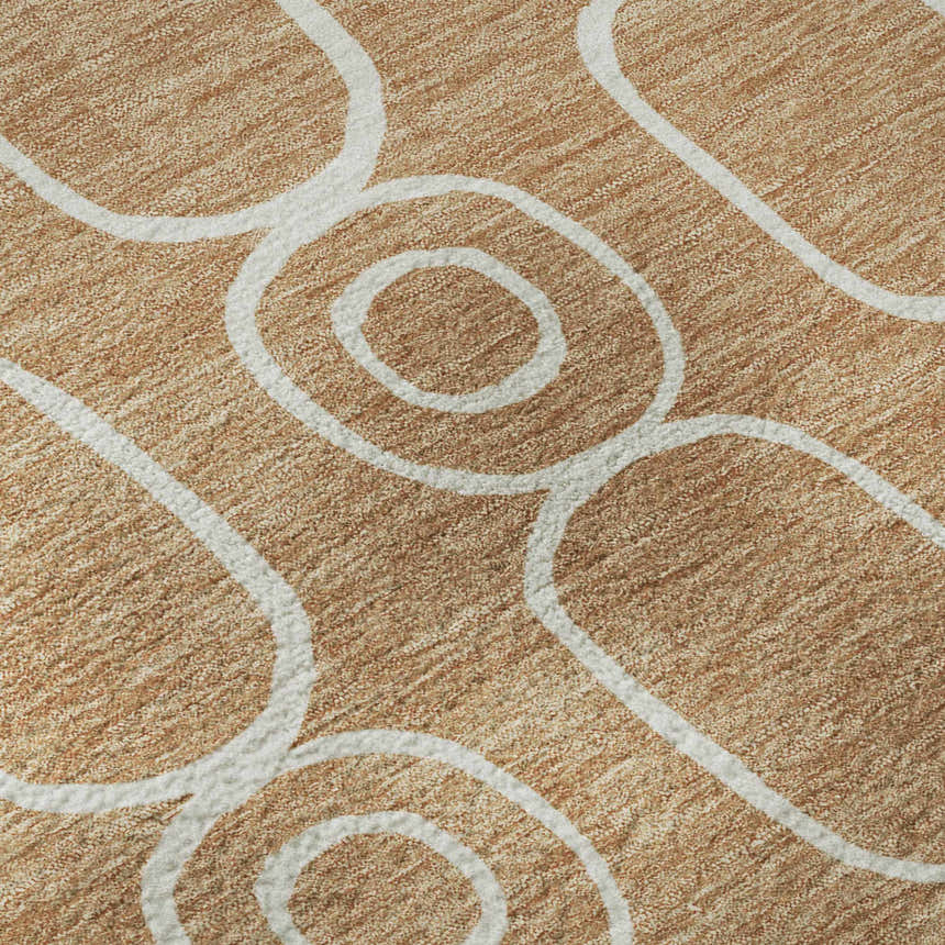 Close-up of Dalyn Luxury The Reserve TR6 Copper Washable Area Rug. Caramel rug with white geometric circle pattern.