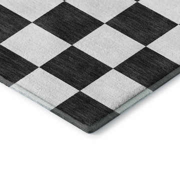 Close-up of Dalyn Luxury The Reserve TR7 Black Washable Area Rug with a black and off white geometric diamond pattern.