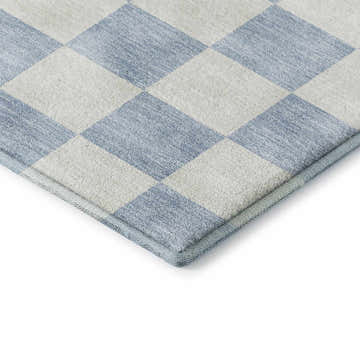 Close-up of Dalyn Luxury The Reserve TR7 Sky Washable Area Rug with a geometric diamond pattern in sky blue and off-white.