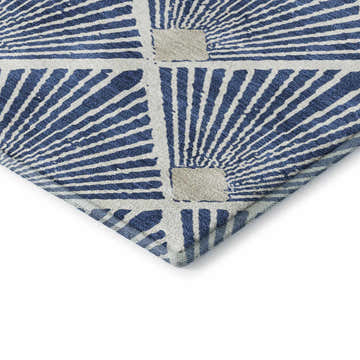 Close-up of the Dalyn Luxury The Reserve TR9 Navy Washable Area Rug featuring a geometric sunburst pattern.