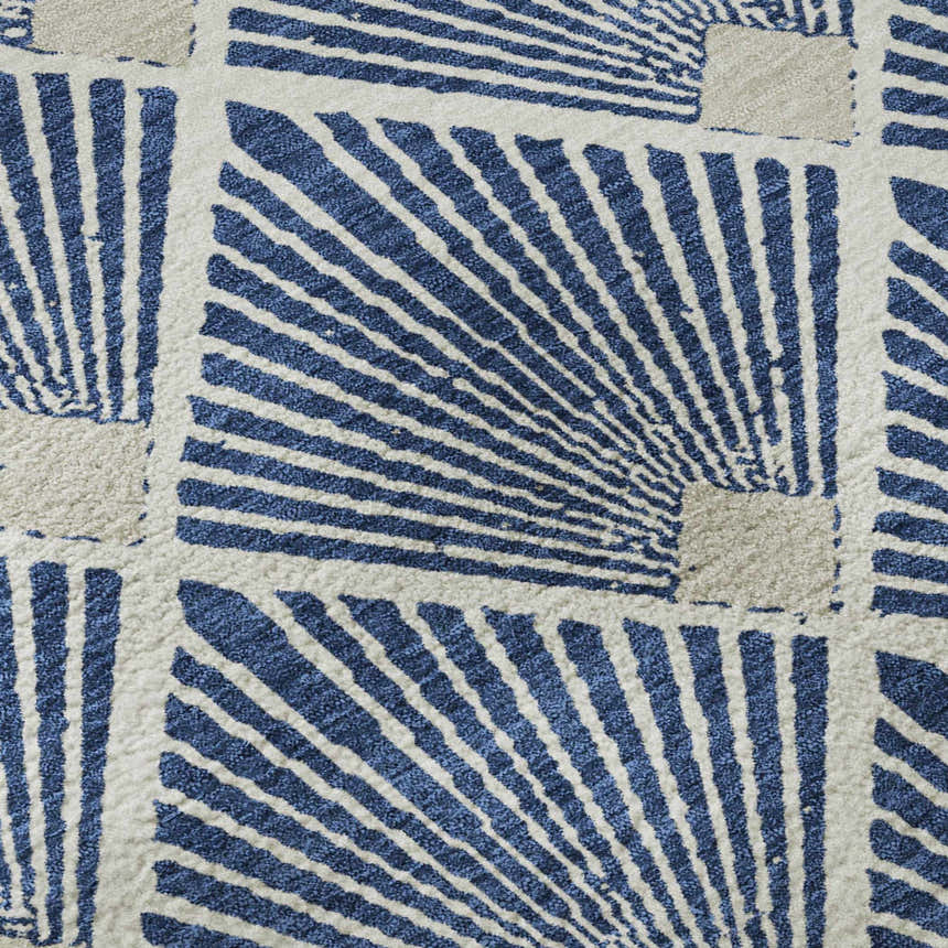 Close-up of Dalyn Luxury The Reserve TR9 Navy Washable Area Rug. Geometric pattern in navy and neutral tones.