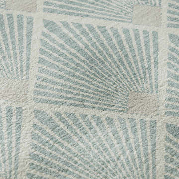 Close-up of Dalyn Luxury The Reserve TR9 Seafoam Washable Area Rug with a geometric fan pattern and soft, plush texture.