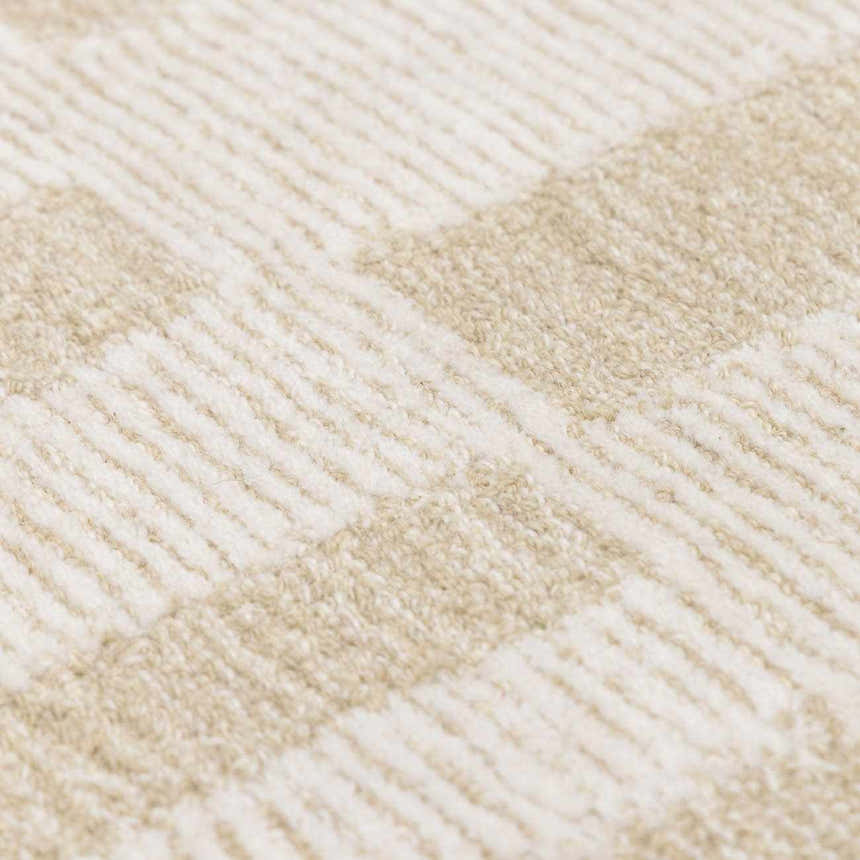 Close-up of the hand-tufted Teige Light Silver Area Rug. Neutral sterling gray and light silver geometric pattern. Soft wool texture. Texture
