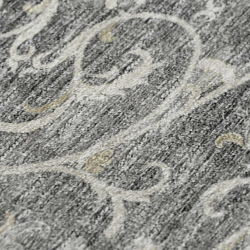 Close-up of the Dalyn Indoor/Outdoor Tuscany TU6 Charcoal Area Rug. Features a beige scroll pattern on a charcoal background.
