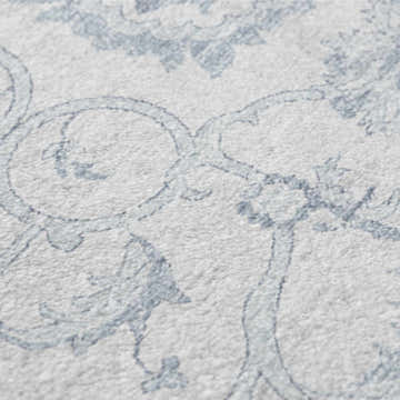 Close-up of the Dalyn Indoor/Outdoor Tuscany TU8 Denim Area Rug showing its beige base and denim floral pattern.