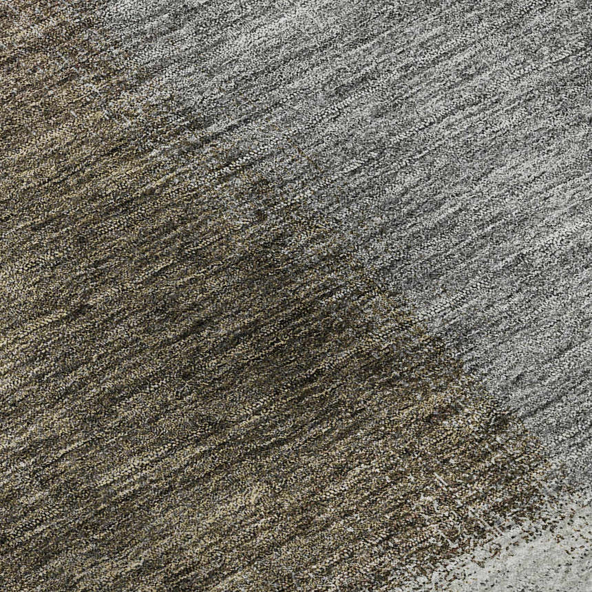 Close-up of the Dalyn Luxury Indoor/Outdoor Trevi TV10 Pewter Washable Area Rug, showing beige, brown, and gray textures.