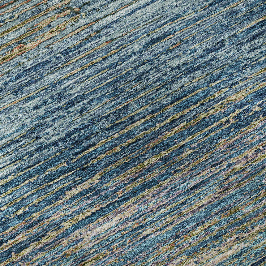 Close-up of Dalyn Luxury Trevi TV1 Denim Washable Area Rug. Features a textured, striped pattern in denim, beige, and olive tones.