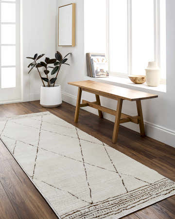 Entryway with ivory Tyson Area Rug runner, wood bench, and dark red accents. Roomscene-Runner