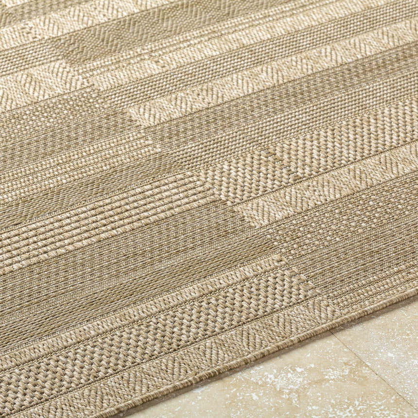Close-up of the Thana Brown Area Rug featuring a textured, striped pattern in camel, prairie dust, and tan hues. Texture