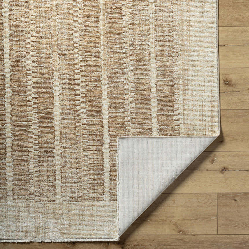 Close-up of the Usonia USO-2302 rug showing its textured, light brown and white contemporary pattern and backing. Fold
