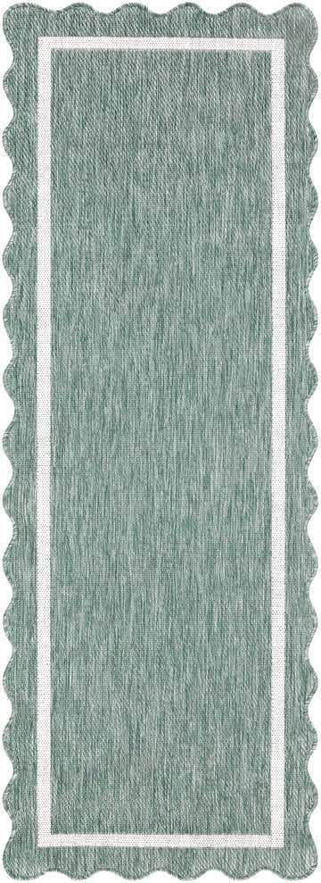 Close up of Varro Medium Green Area Rug showing texture, cream trim, and scalloped edge. Design-Runner-2773