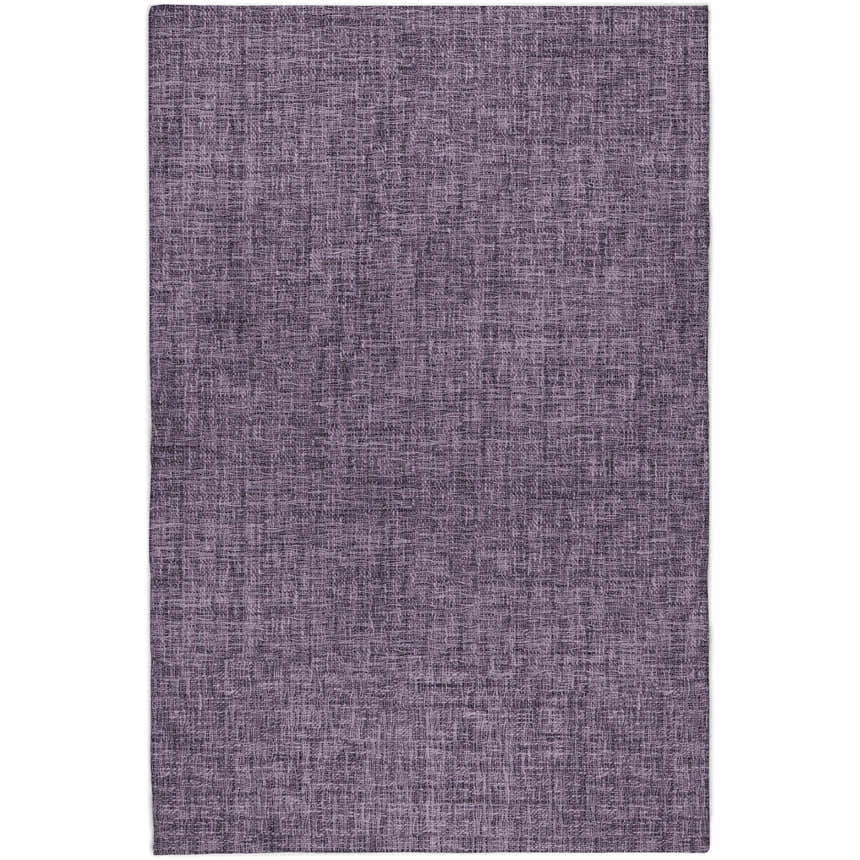 Close-up of the Dalyn Luxury Voyage VY1 Plum Washable Area Rug, showing its dark purple color and woven texture.