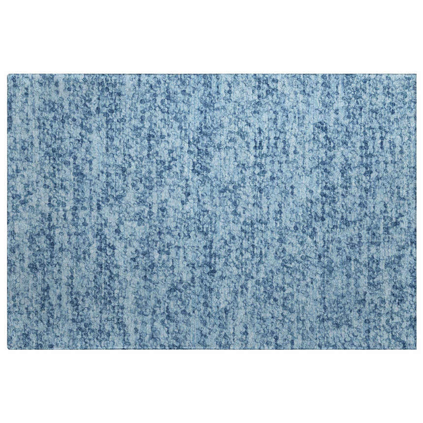 Close-up of Dalyn Luxury Voyage VY2 Denim Washable Area Rug. Features a textured denim blue pattern. Farmhouse style.