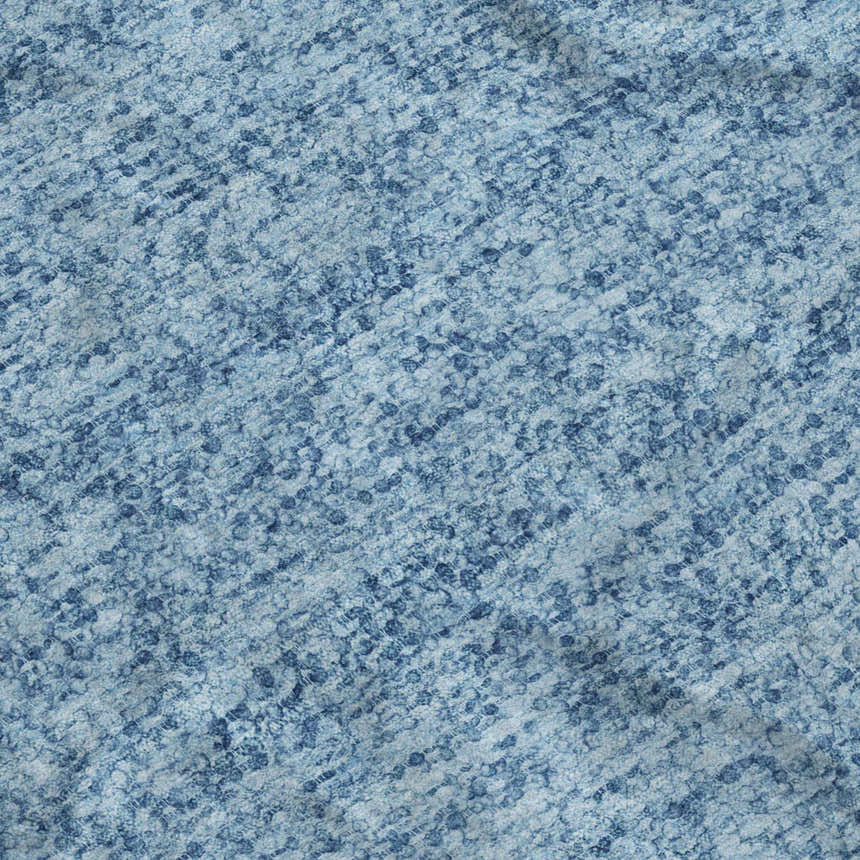 Close-up of Dalyn Luxury Voyage VY2 Denim Washable Area Rug. Features a textured, mottled denim blue pattern.