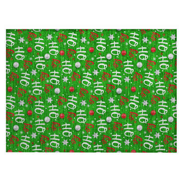 Close-up of Dalyn Wonderland WN18 Green Washable Area Rug. Holiday style with Ho Ho, stars, ornaments, and red ribbon on a green background.