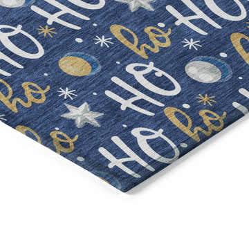 Close-up of Dalyn Wonderland Navy Washable Area Rug. Holiday design with gold, off-white