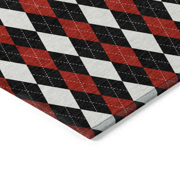 Close-up of the Dalyn Wonderland WN20 Black Washable Area Rug. Features a black, off white, and red argyle pattern.