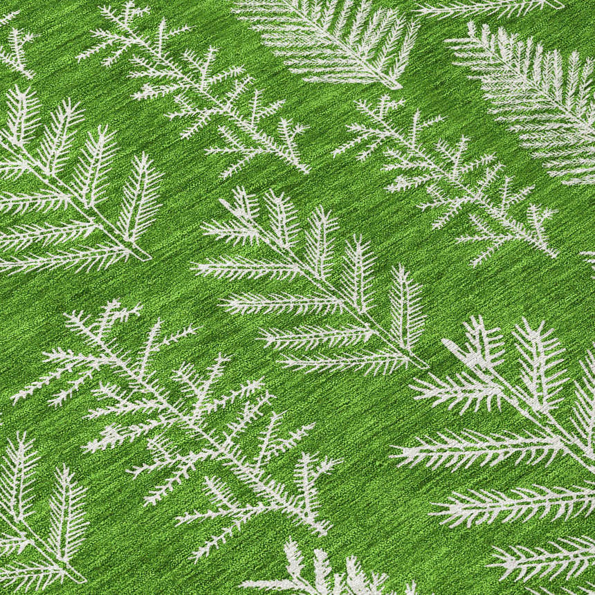 Close-up of Dalyn Wonderland WN21 Green Washable Area Rug. Features a bright green background and white pine tree branch pattern.