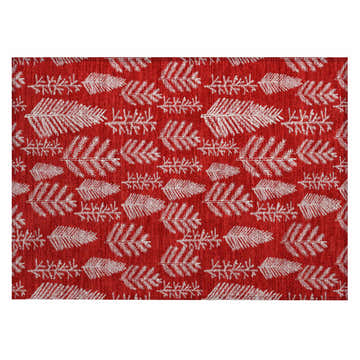 Close-up of Dalyn Wonderland WN21 Red Washable Area Rug with a festive white fir leaf pattern on a chestnut red background.