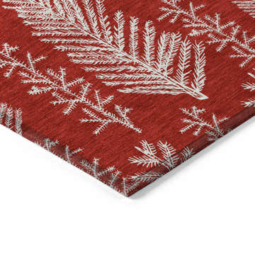 Close up of the Dalyn Wonderland WN21 Red Washable Area Rug, featuring a chestnut base and white holiday-themed leaf pattern.