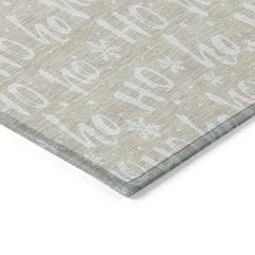 Close-up of Dalyn Wonderland WN22 Beige Washable Area Rug featuring a festive Ho Ho Ho and snowflake pattern.