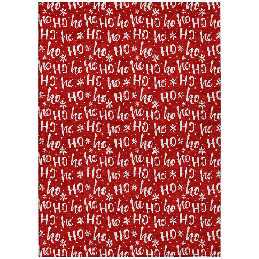 Close-up of Dalyn Wonderland WN22 Red Washable Area Rug. Holiday style with white Ho Ho text and snowflakes on a red background.