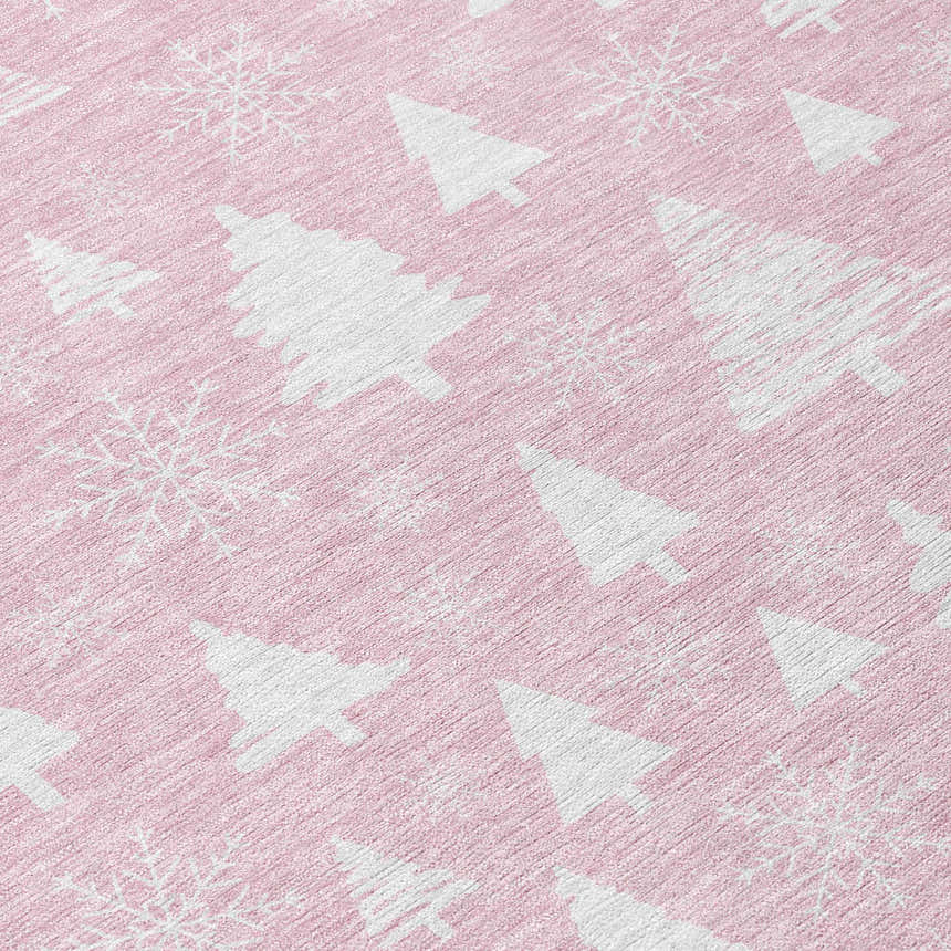 Close-up of Dalyn Wonderland WN23 Pink Washable Area Rug with white Christmas tree and snowflake pattern.