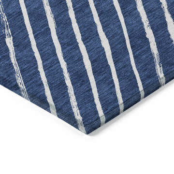 Close-up of the Dalyn Wonderland WN27 Navy Washable Area Rug. Features a navy background with white, painted-style stripes.