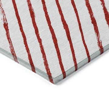 Close-up of Dalyn Wonderland WN27 Red Washable Area Rug with off-white background and bold red stripes.