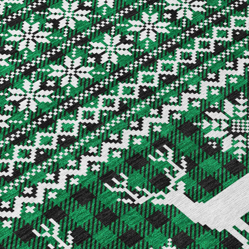 Close-up of Dalyn Wonderland WN28 Green Washable Area Rug. Features a holiday pattern with green, black, and white pixelated reindeer.