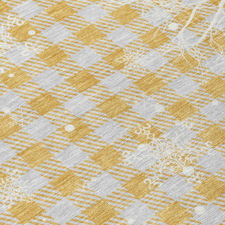 Close-up of Dalyn Wonderland WN32 Gold Washable Area Rug. Chestnut and gold diamond pattern with subtle holiday accents.