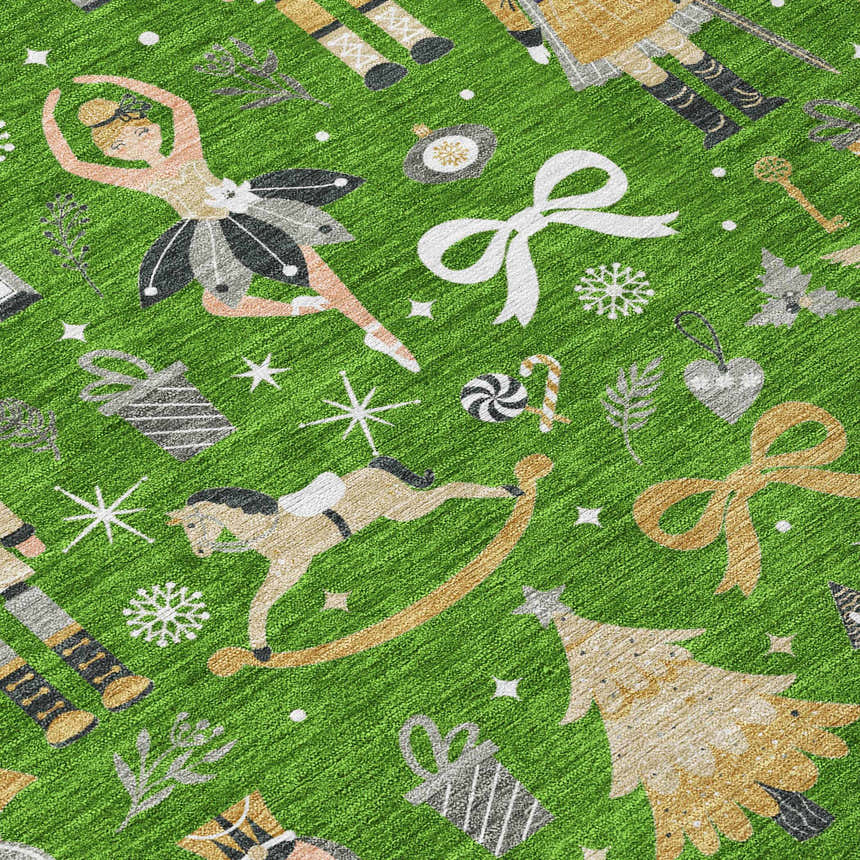Close-up of Dalyn Wonderland WN35 green washable rug. Features holiday pattern with ballerina, nutcracker, tree, and rocking horse.