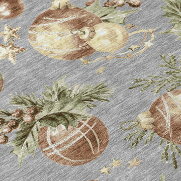 Close-up of Dalyn Wonderland WN36 Gray Washable Area Rug featuring holiday ornaments and greenery on a gray background.