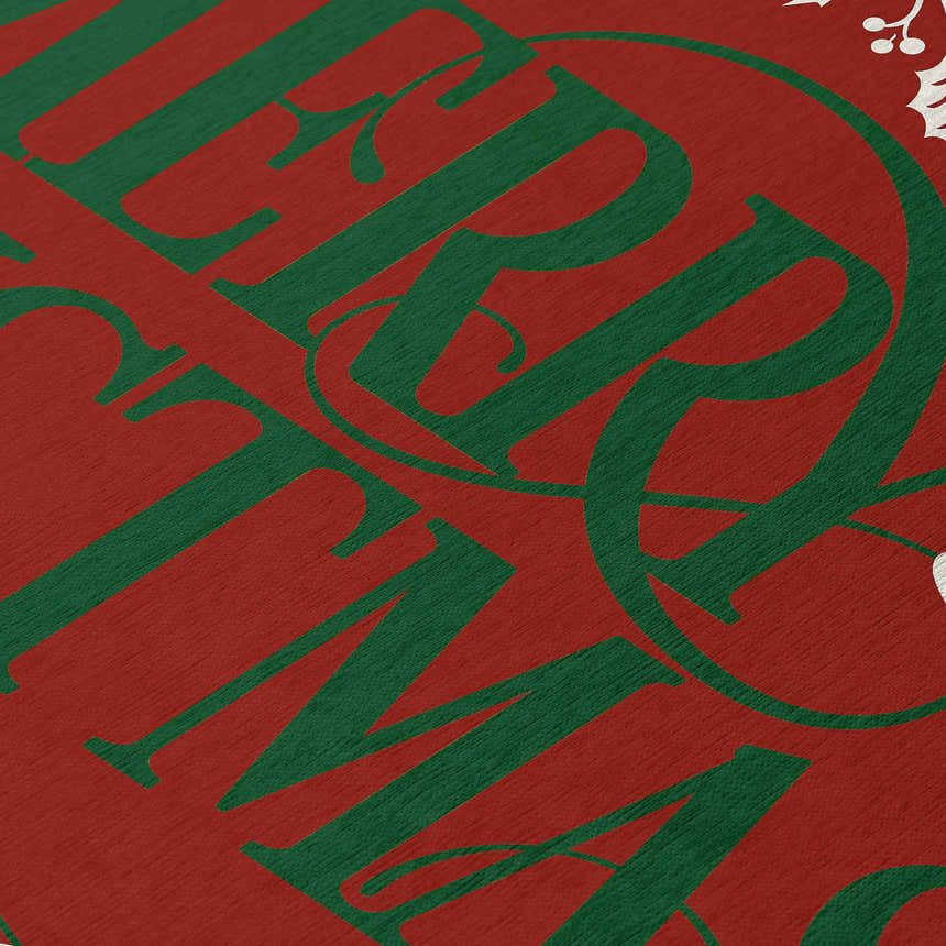 Close-up of the Dalyn Wonderland WN6 Red Washable Area Rug. Red background with green holiday text.
