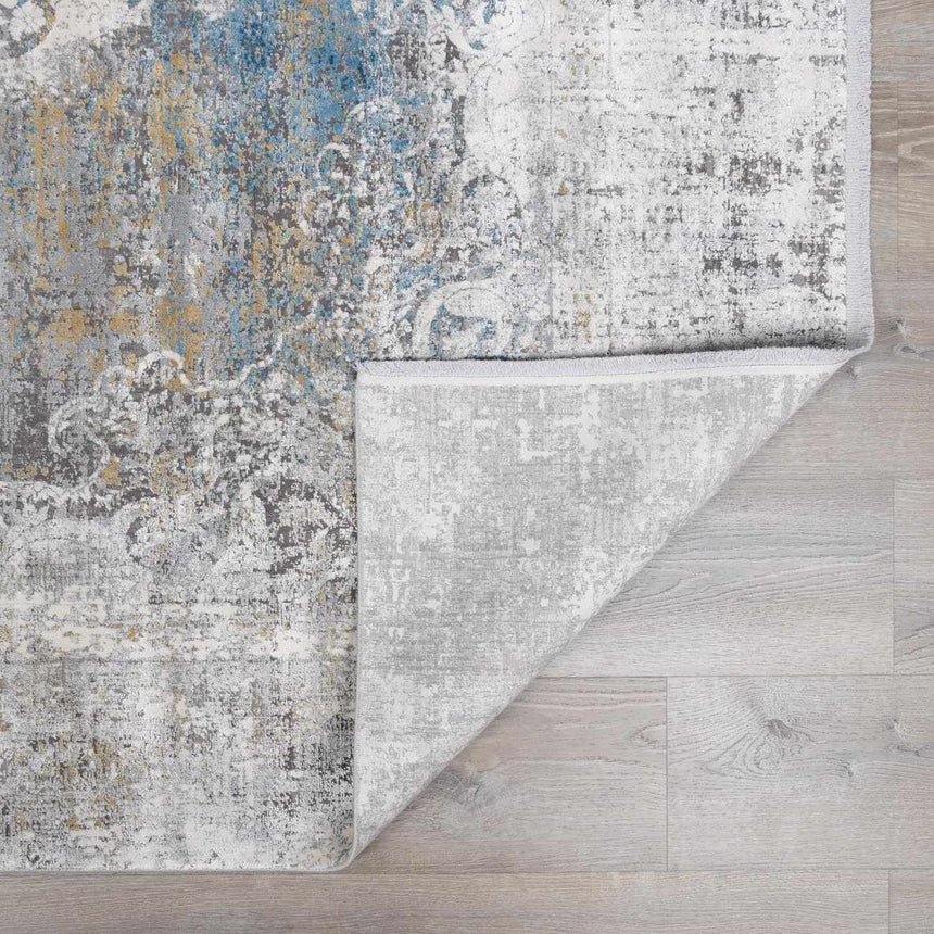 Calion Distressed Blue Luxury Fringed Faux Silk Rug