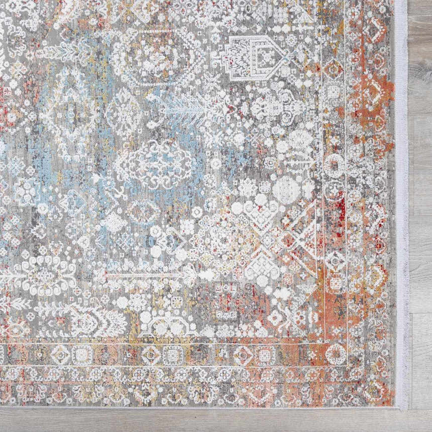 Close-up of the Witheridge Area Rug, showcasing its traditional design with gray, blue, pink, and red tones. Swatch