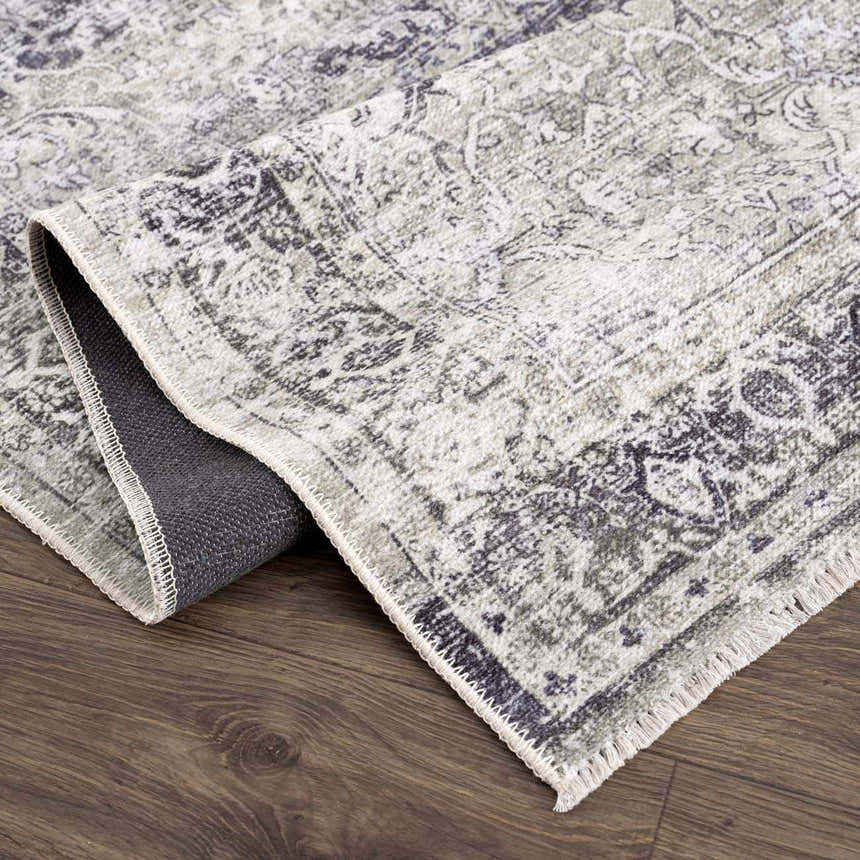 Close-up of the Gray Holi-4607 Washable Area Rug showing its vintage traditional pattern, gray and white colors, and soft texture. Fold
