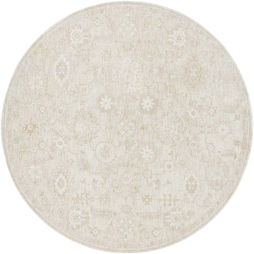 Close-up of a round Yonca Luxe Rug in ash and light silver. The rug has a traditional, floral-inspired pattern. Design-Round-7