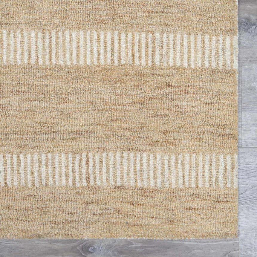Close-up of the hand-tufted Yoyko Area Rug. Tan wool rug with a textured stripe design in pearl. Swatch