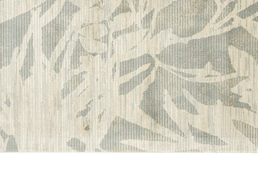 Close up of the Calvin Klein Home Maya Zinc/Paloma rug showing the abstract pattern and textures.