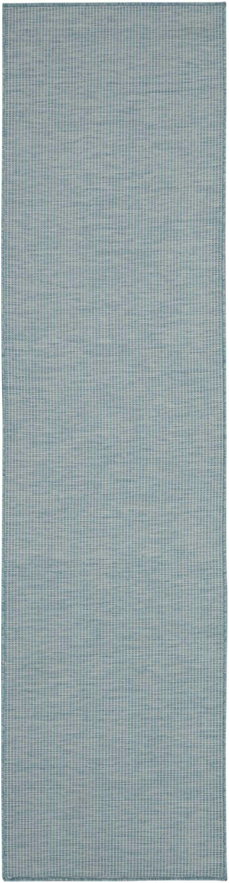 Close-up of the Nourison Positano Aqua rug. Modern design with a subtle, textured aqua and white pattern.