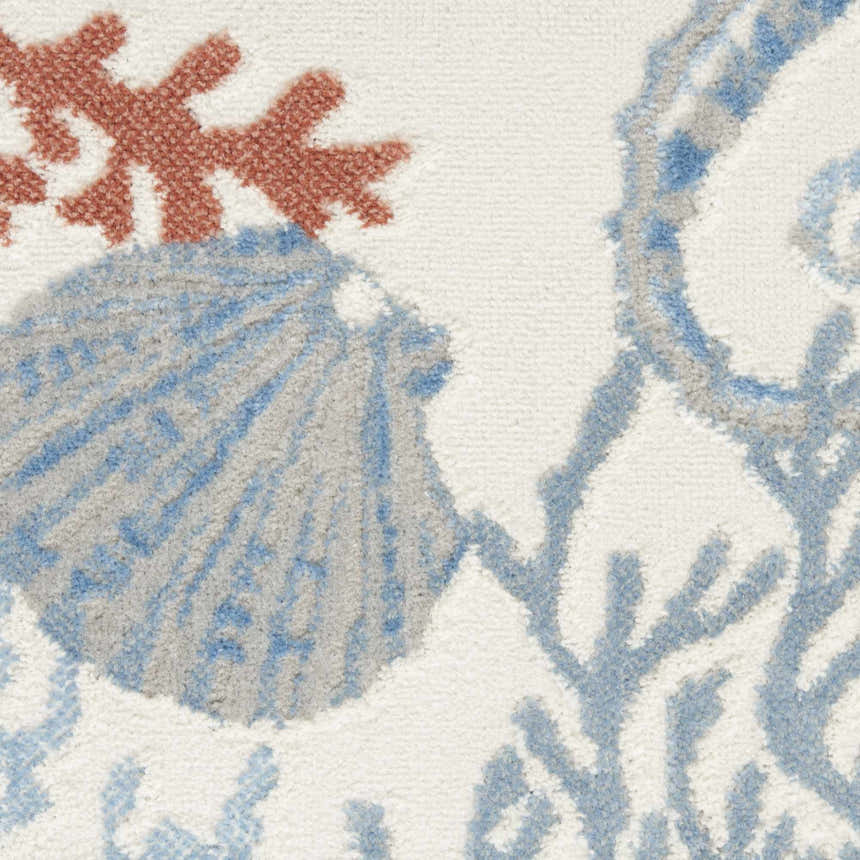 Close-up of Nourison Seaside Ivory Multicolor rug with coral, seashell, and sea plant pattern. Coastal style.