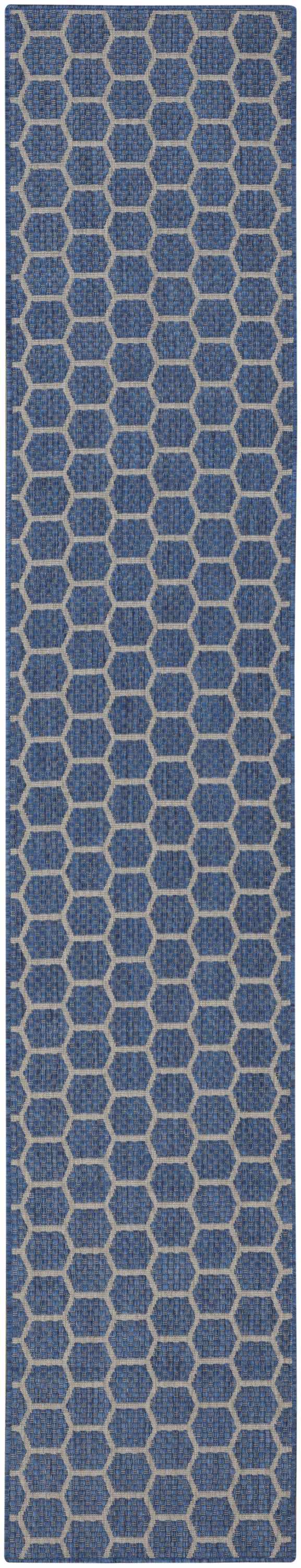 Close-up of the Nourison Twist Reversible Blue Modern Area Rug featuring a geometric hexagon pattern.