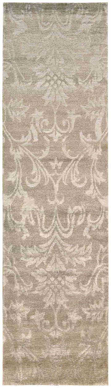 Close-up of the light gold Nourison Silk Shadows rug. Features a vintage floral pattern and soft, silk-like texture.