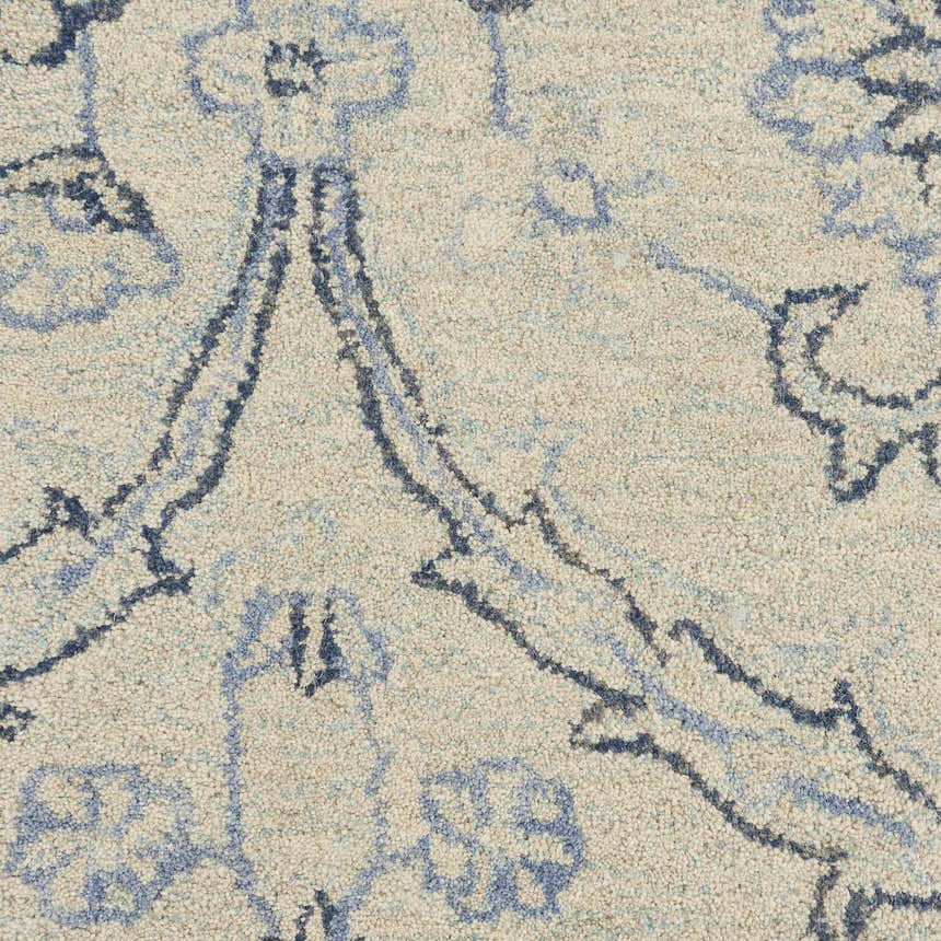 Close up of the Nourison Jazmine rug in ivory and blue. Wool rug with a detailed Persian design.