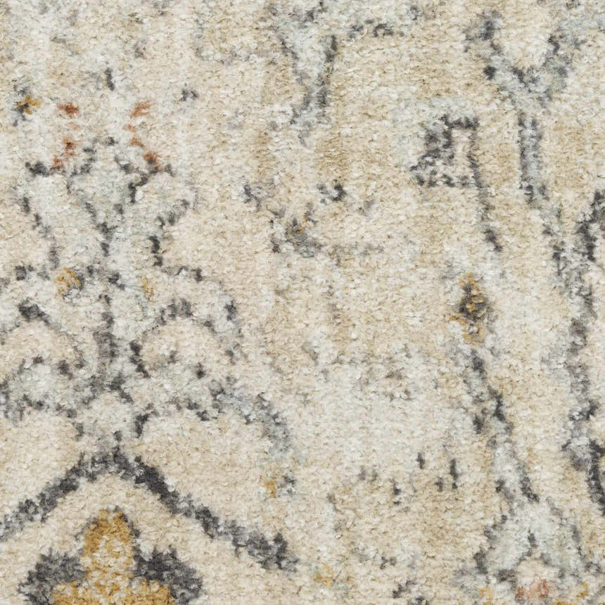 Close-up of the cream Nourison Oushak Home rug showing vintage pattern and soft, textured weave.