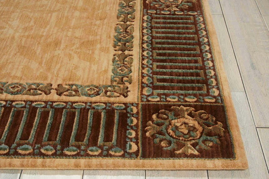 Close-up of the Nourison Vallencierre Beige Vintage Area Rug, showcasing its floral border, brown accents, and soft texture.